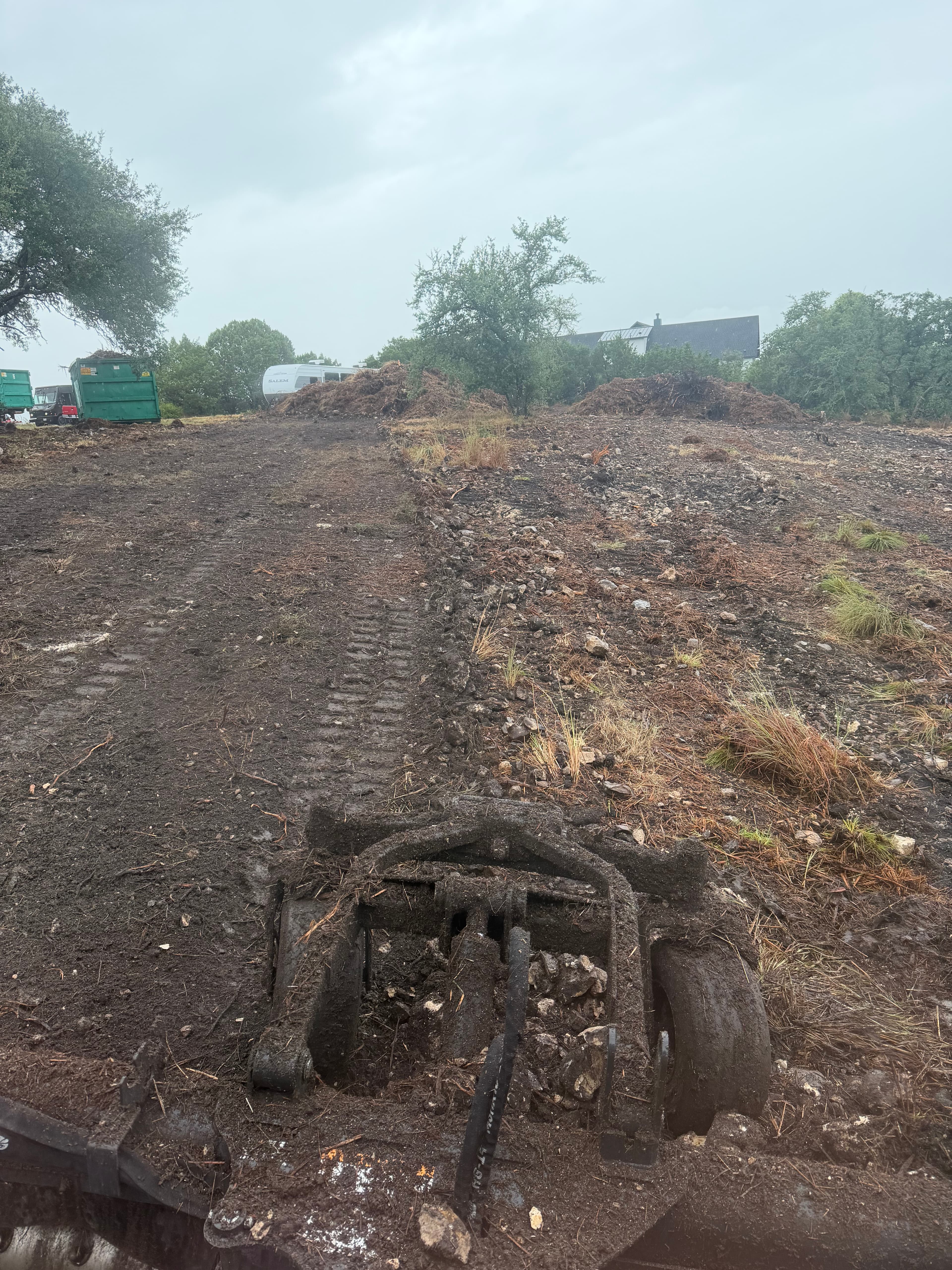 Rock removal with rake attachment in Central Texas